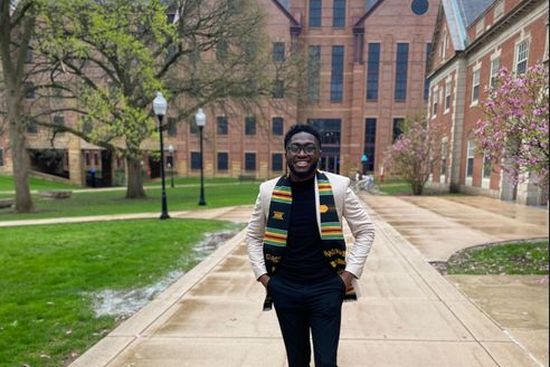 Graduate Student in front of SFHB