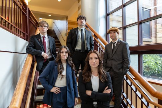 Students on Atrium Stairs