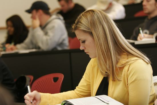 student studying in a classroom setting